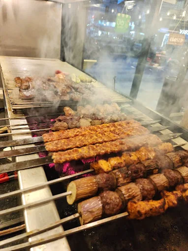 Traditional Turkish kebabs cooking on the ocakbasi grill